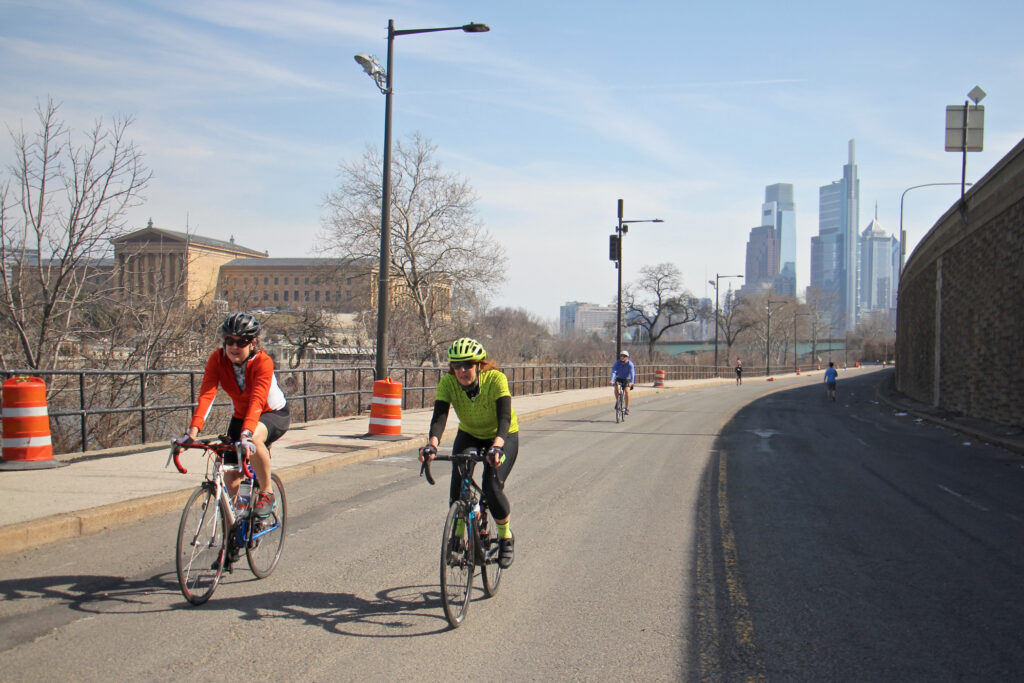 2021 03 11-e lee-philadelphia martin luther king drive-warm weather Cyclists and joggers use Martin Luther King Drive on March 11, 2021, which has been closed to traffic since the start of the pandemic. (Emma Lee/WHYY)