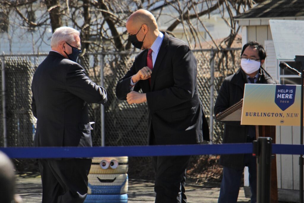 2021 03 15-e lee-robert menendez cory booker andy kim-burlington nj samuel smith elementary school-help is here New Jersey U.S. Sens. Robert Menendez (left) and Cory Booker bump elbows while U.S. Rep. Andy Kim looks on