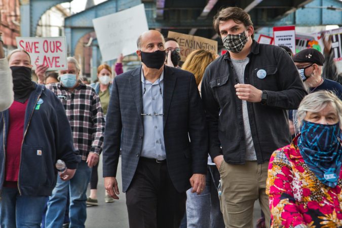 Councilmember Mark Squilla joins a march with residents protesting over Somerset Station's closure