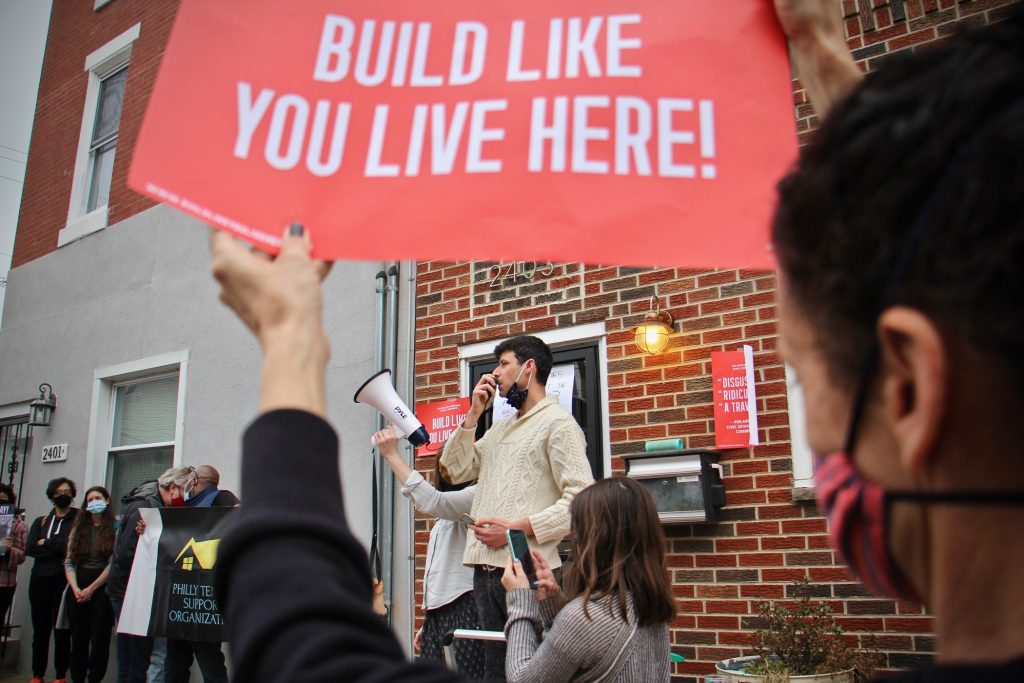 2021 03 25-e lee-adrian bondy-philadelphia 2400 east hunterdon street-development protest Adrian Bondy, a leader of the Build Like You Live Here neighborhood organization, speaks to protesters during a rally at 2400 East Huntingdon Street. A seven-story building is planned for that address in a neighborhood of two- and three-story rowhouses. (Emma Lee/WHYY)