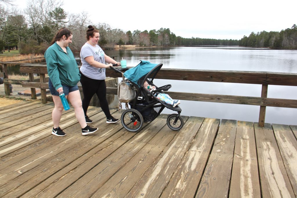 2021 03 25-e lee-maegan nelson sarah nargi-wharton state forrest-batsto lake Maegan Nelson (right) and her cousin, Sarah Nargi, stroll along Batsto Lake in Wharton State Forrest with Nargi's daughter, Paisley.