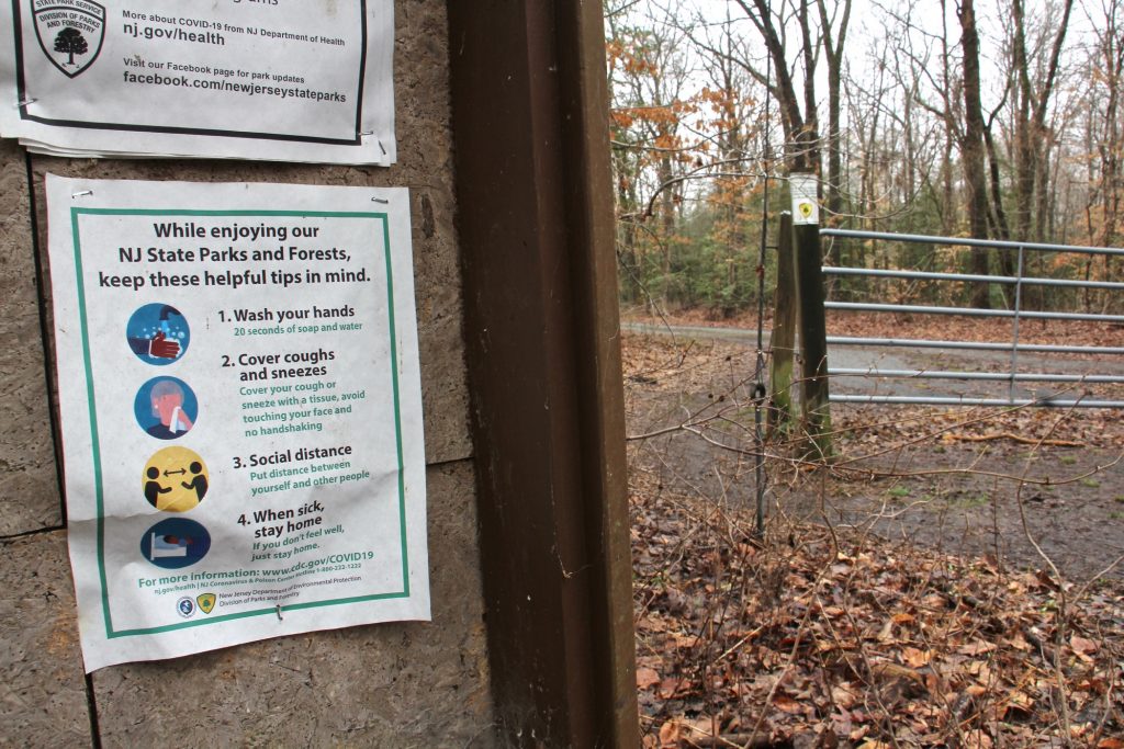 2021 03 25-e lee-rancocas state park-flyer A flyer detailing COVID-19 precautions persists at Rancocas State Park in Burlington County, N.J. (Emma Lee/WHYY)