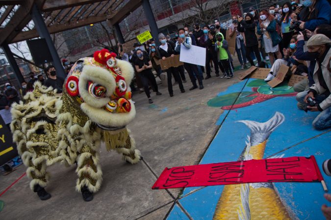 The Lion Dancers perform at a solidarity rally in protest of anti-Asian violence at 10th and Vine streets in Philadelphia on March 25, 2021. (Kimberly Paynter/WHYY)