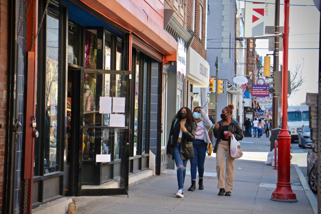 2021 03 30-e lee–philadelphia south street headhouse-easter egg hunt shoppers Shoppers walk on South Street