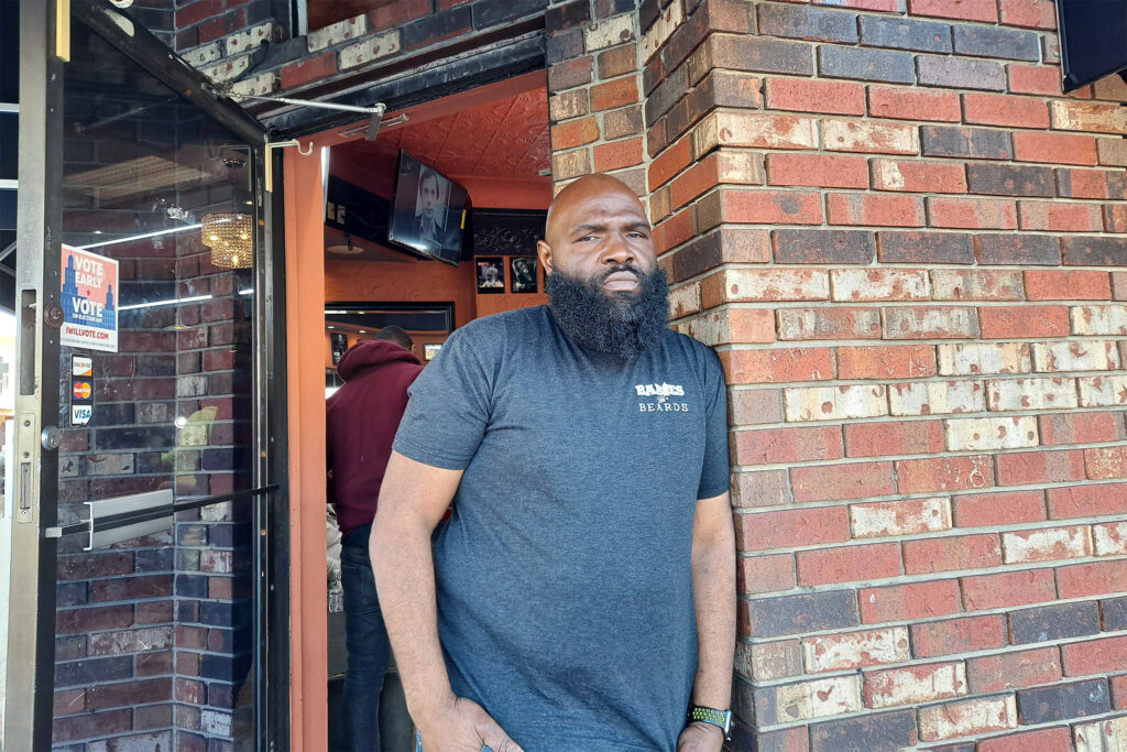20210310_152635 Faheem Alexander, owner of Faheem’s Hands of Precision Barber Shop, said he and his staff try and set good examples for young people. But to fight gun violence it's going to take others to pitch in. (Ximena Conde / WHYY)