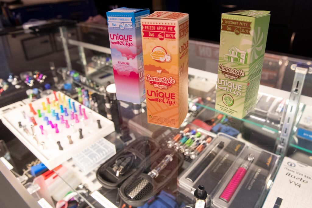 Vaping Flavors This Jan. 2, 2020, file photo shows flavored vaping liquids and devices on display at the VapeNY.com store in New York. (AP Photo/Mary Altaffer)
