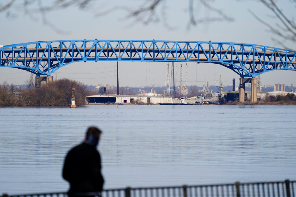 Bridge Tolling A person walks past the Interstate-95′s mile-long double-decked Girard Point Bridge in Philadelphia, Wednesday, Feb. 24, 2021. (AP Photo/Matt Rourke)