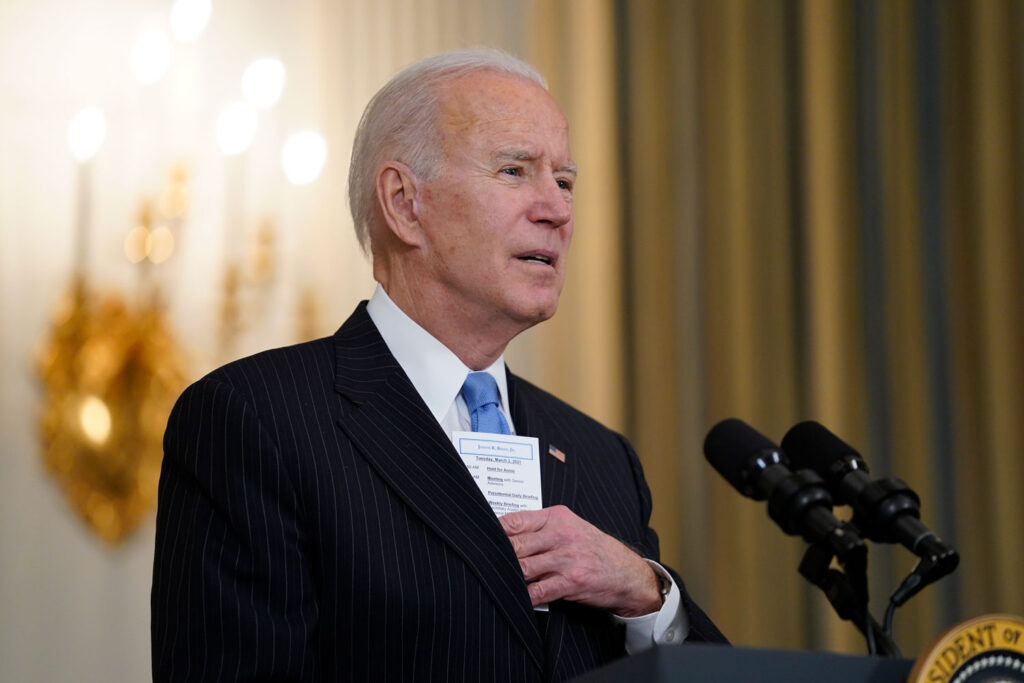 AP21061778358268 President Joe Biden speaks about efforts to combat COVID-19, in the State Dining Room of the White House, Tuesday, March 2, 2021, in Washington.