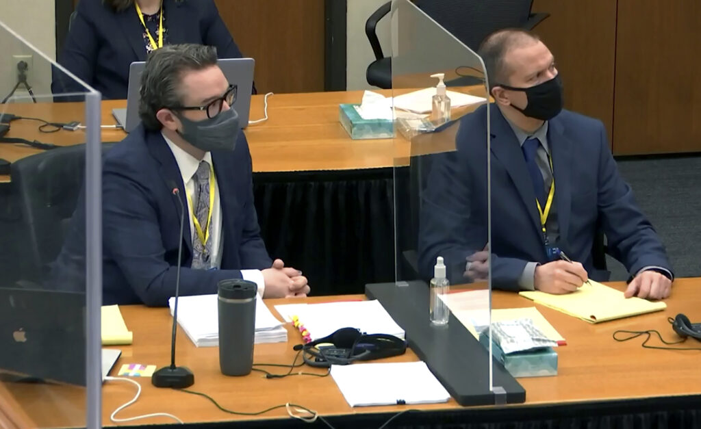 George Floyd Officer Trial In this image taken from video, defense attorney Eric Nelson, left, and defendant, former Minneapolis police officer Derek Chauvin, right, listen to Hennepin County Judge Peter Cahill during pretrial motions, prior to continuing jury selection in the trial of Chauvin, Thursday, March 11, 2021, at the Hennepin County Courthouse in Minneapolis, Minn. (Court TV/Pool via Pool)