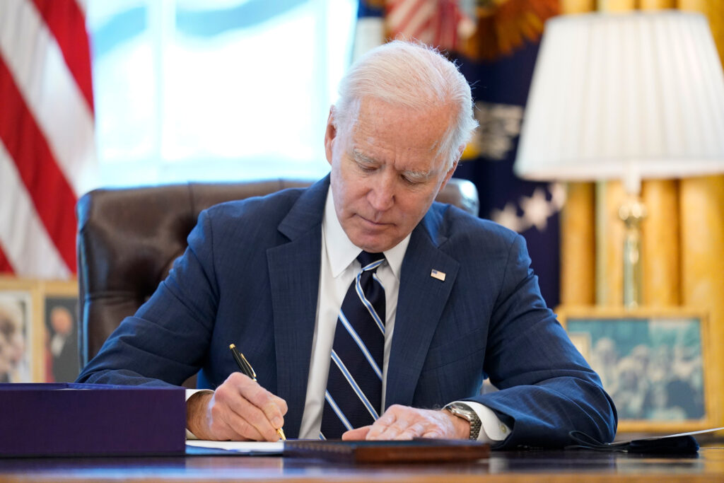 Joe Biden,Kamala Harris President Joe Biden signs the American Rescue Plan, a coronavirus relief package, in the Oval Office of the White House, Thursday, March 11, 2021, in Washington. (AP Photo/Andrew Harnik)