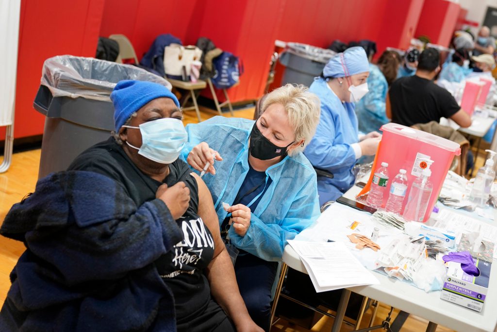 Virus Outbreak New Jersey Mary Jenkins, left, received the COVID-19 vaccine in Paterson, N.J., Thursday, Jan. 21, 2021. (AP Photo/Seth Wenig)