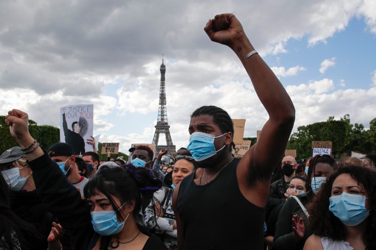 In this June 6, 2020, file photo, hundreds of demonstrators gather on the Champs de Mars as the Eiffel Tower is seen in the background during a demonstration in Paris to protest against the recent killing of George Floyd. (AP Photo/Francois Mori)