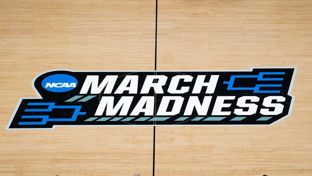 The March Madness logo is shown on the court