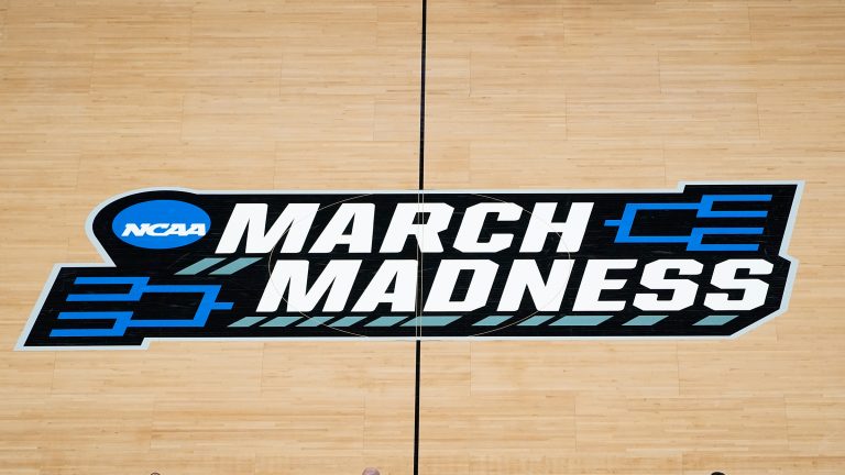 The March Madness logo is shown on the court