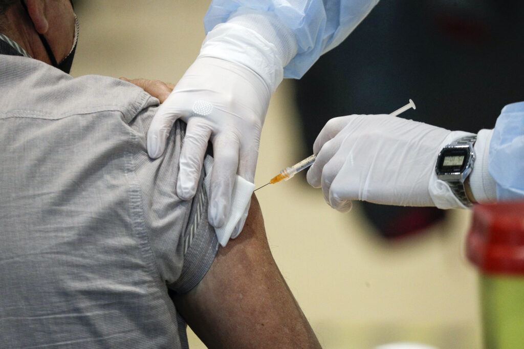 Virus Outbreak AstraZeneca Staff members administer the AstraZeneca vaccine