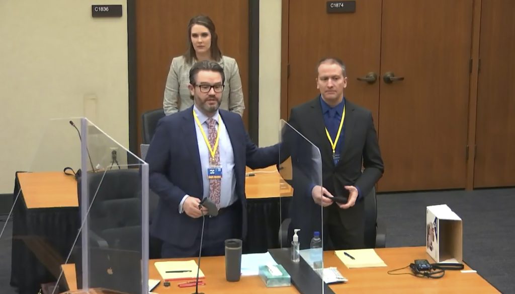George Floyd Jurors Burdens Defense attorney Eric Nelson, left, defendant and former Minneapolis police officer Derek Chauvin, right, and Nelson's assistant Amy Voss, back, introduce themselves to potential jurors