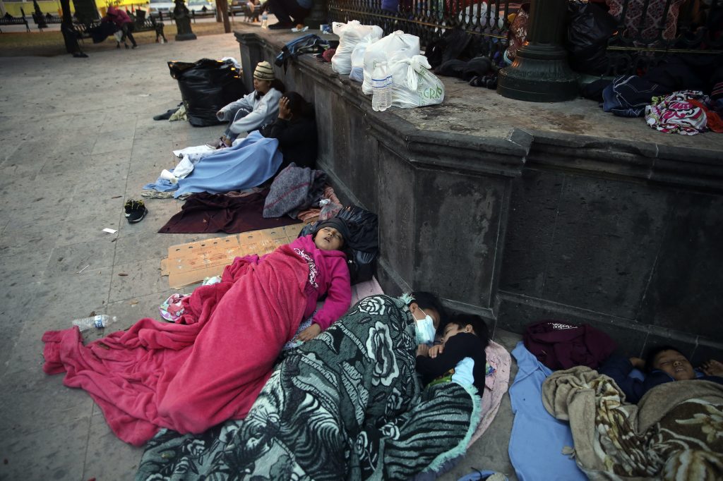 APTOPIX Immigration Border Expulsions Migrants sleep under a gazebo at a park in the Mexican border city of Reynosa