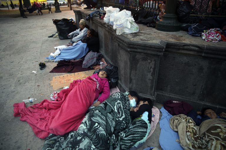 Migrants sleep under a gazebo at a park in the Mexican border city of Reynosa