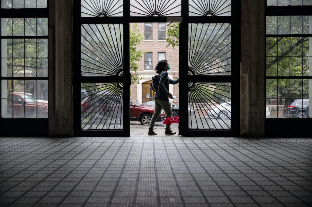 AP_mental_health_doctor_032921.jpg Dr. Jeanie Tse opens a door to leave a residence
