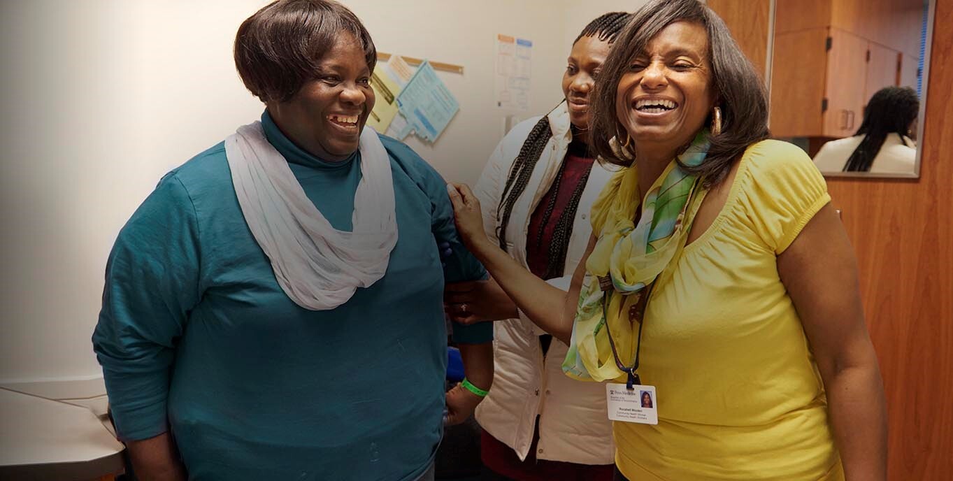 Philadelphia Community health worker Rocshell Wooten (far-right) accompanies patient Grace Ikpe to their primary care appointment