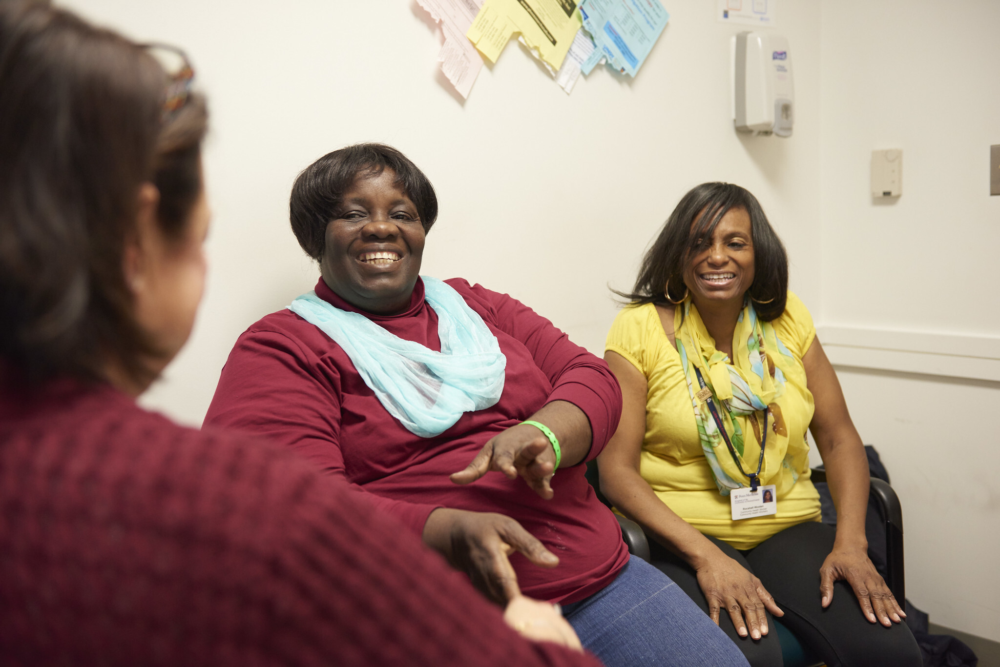 Philadelphia community health worker Rocshell Wooten (far-right) accompanies patient Grace Ikpe to their primary care appointment