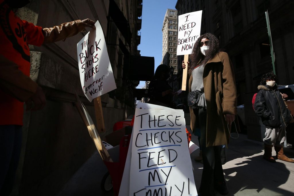 PA_unemployment_protest_SPA_032421 Michelle Perry protests Pa.'s unemployment system in front of Gov. Tom Wolf's Center City office