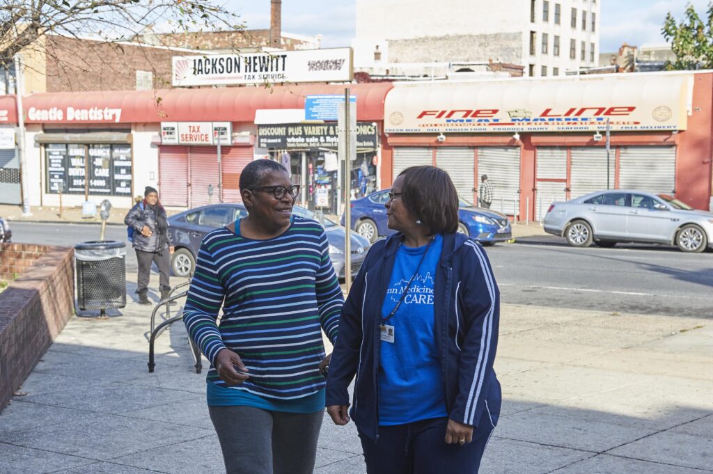 Phyllis Jones Carter w CHW 2 West Philadelphia resident Phyllis Carter (left) takes a walk with her community health worker