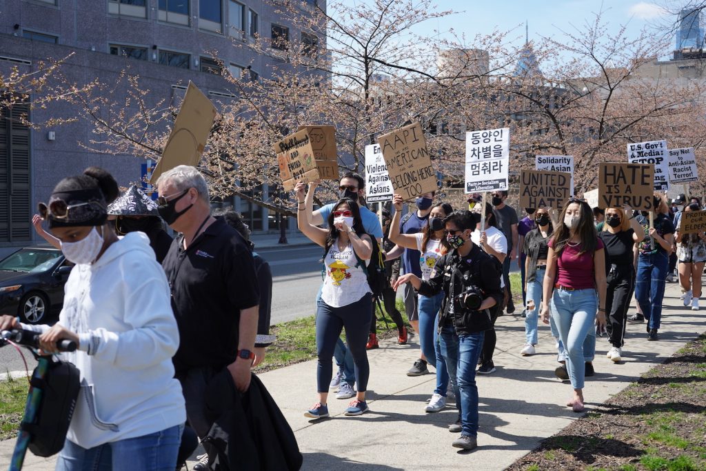 Protest Shot 6 Protesters march west on Sixth Street during a rally against anti-Asian violence in Philadelphia on March 27, 2021. (Kenny Cooper/WHYY)