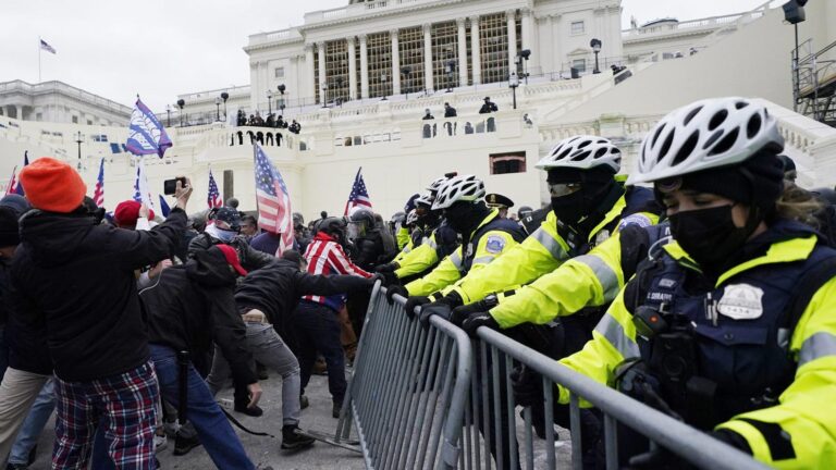 Trump supporters try to break through a police barrier, Wednesday, Jan. 6, 2021, at the Capitol in Washington. As Congress prepares to affirm President-elect Joe Biden's victory, thousands of people have gathered to show their support for President Donald Trump and his claims of election fraud.