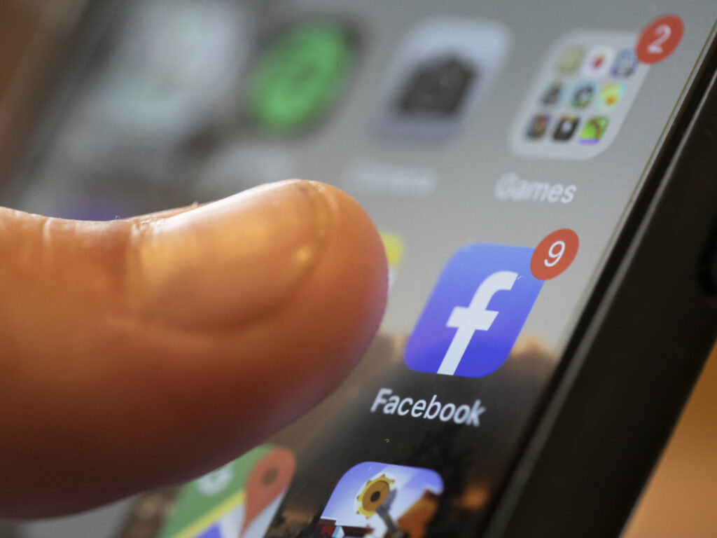 Critics say Facebook does not apply its rules against misinformation as robustly to posts in Spanish, allowing harmful claims to spread. (Jenny Kane/AP)