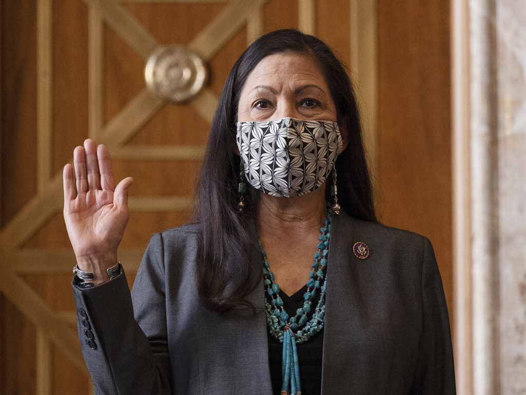 Rep. Deb Haaland, D-N.M., is sworn in before her Senate confirmation hearing to be Interior Secretary last month. Her confirmation makes her the country’s first Native American cabinet secretary. Rep. Deb Haaland, D-N.M., is sworn in before her Senate confirmation hearing to be Interior Secretary last month. Her confirmation makes her the country's first Native American cabinet secretary. (Jim Watson/AP)