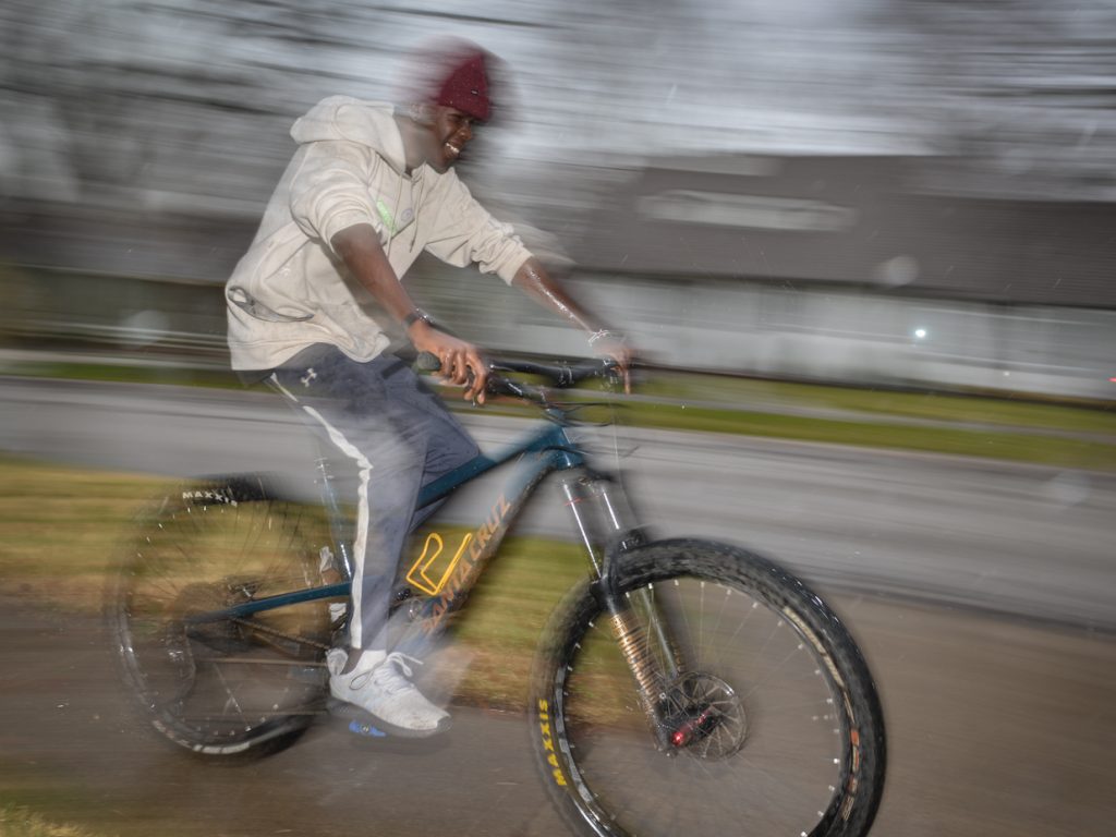 Awak Awak rides a mountain bike