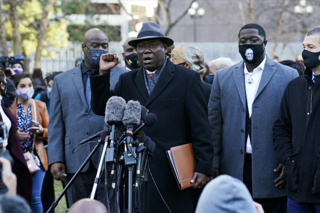 Ben Crump George Floyd family attorney Ben Crump, with fist raised, addresses media along with other attorneys and members of George Floyd’s family outside the Hennepin County Government Center