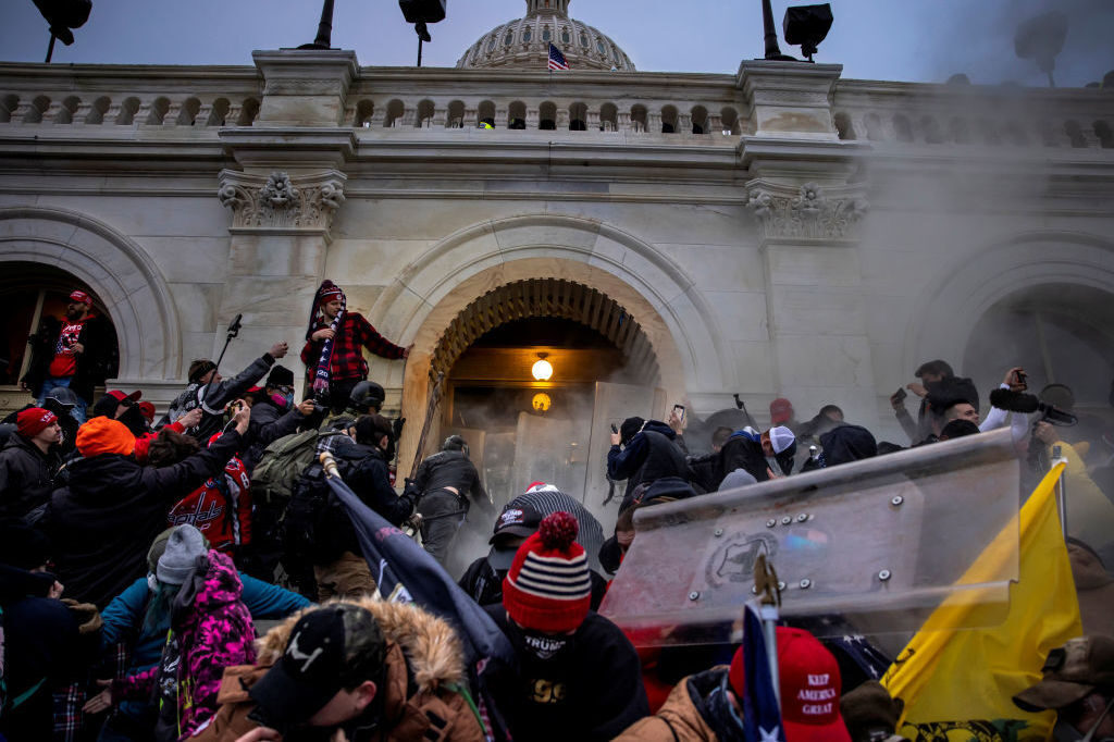 Pro-Trump rioters clash with police and security forces as people storm the U.S. Capitol on Jan. 6. Federal investigators say they expect even more people will be charged in connection with the insurrection. Pro-Trump rioters clash with police and security forces as people storm the U.S. Capitol on Jan. 6. Federal investigators say they expect even more people will be charged in connection with the insurrection. (Brent Stirton/Getty Images)