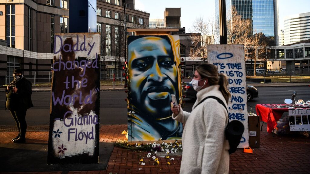 US-RACISM-POLICE-TRIAL A painting of Floyd is seen outside the Hennepin County Government Center