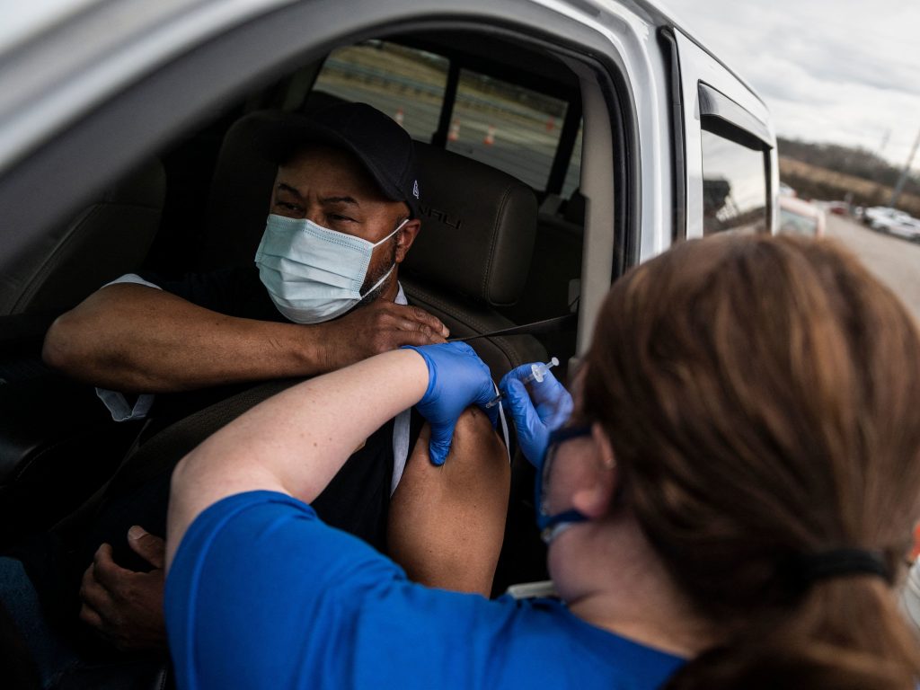 A nurse administers a shot at a COVID-19 mass vaccination site at Martinsville speedway in Ridgeway, Va., on March 12. Ashish Jha, a public health policy researcher, noted Sunday that “despite phenomenal vaccination rates, variants pulled ahead this week.” A nurse administers a shot at a COVID-19 mass vaccination site at Martinsville speedway