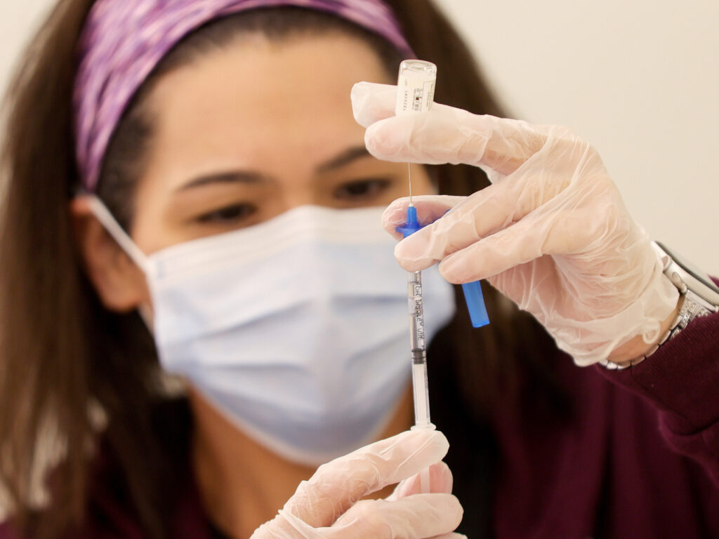 A dose of the new one-shot Johnson & Johnson COVID-19 vaccine is prepared at Baldwin Hills Crenshaw Plaza in South Los Angeles on Wednesday. A dose of the new one-shot Johnson & Johnson COVID-19 vaccine is prepared at Baldwin Hills Crenshaw Plaza in South Los Angeles on Wednesday.