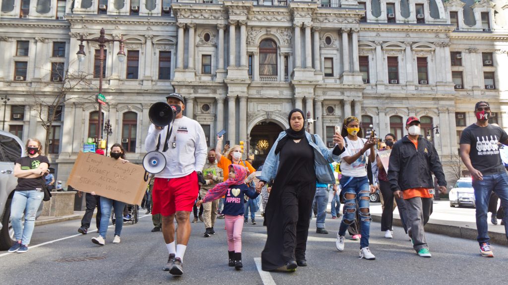 Protesters march down Broad Street