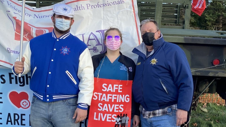 julia and fam Scott Smith, right, and Scott Smith Jr., left, both seafarer union members, supported Julia Smith in her fight for safe staffing at St. Mary Medical Center in Langhorne. (Courtesy of Julia Smith)