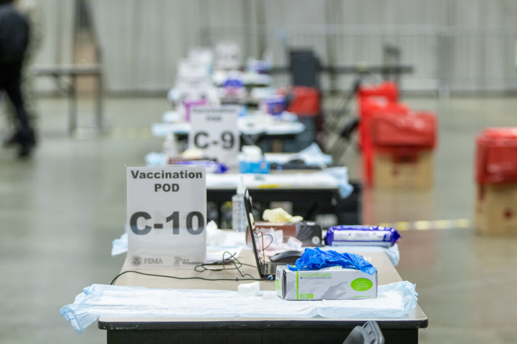 philly_FEMA_mass_coronavirus_vaccine_center_030721_02 Tables are set up inside the FEMA-run coronavirus vaccination site at the Pennsylvania Convention Center in Philadelphia