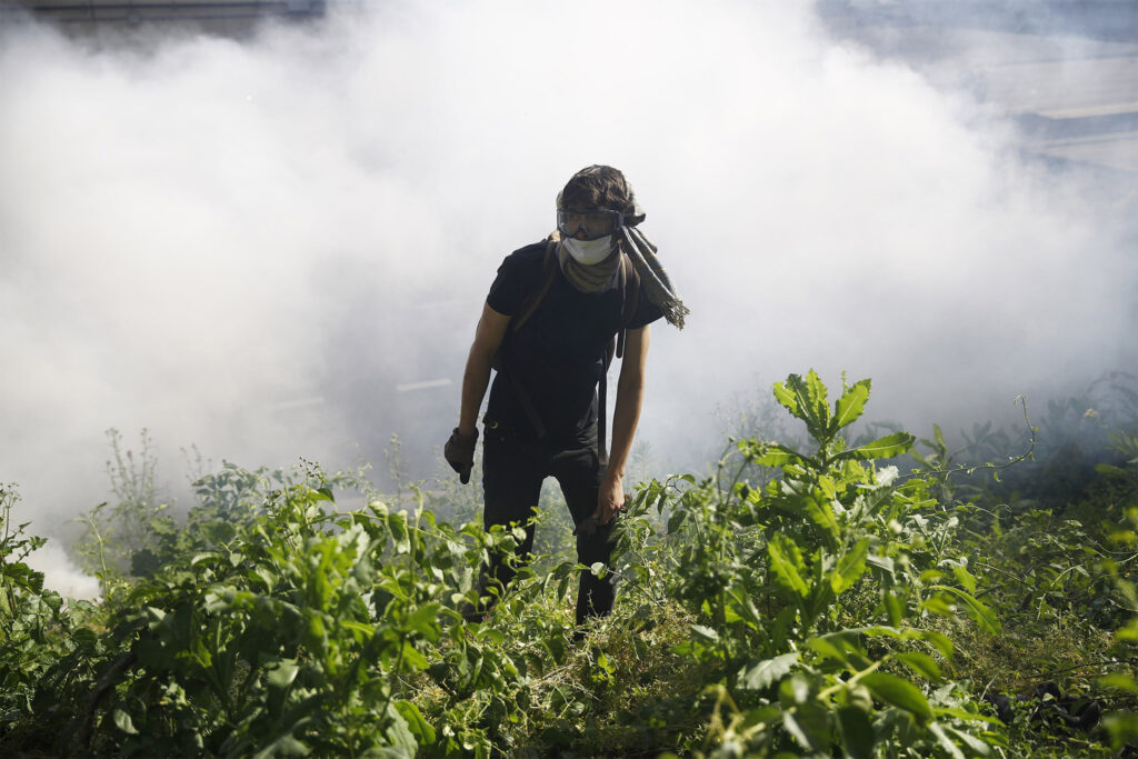 Racial Injustice Philadelphia Protesters A protester kicks a tear gas canister fired by police during protests on Monday, June 1, 2020, in Philadelphia. (Matt Rourke/AP Photo)