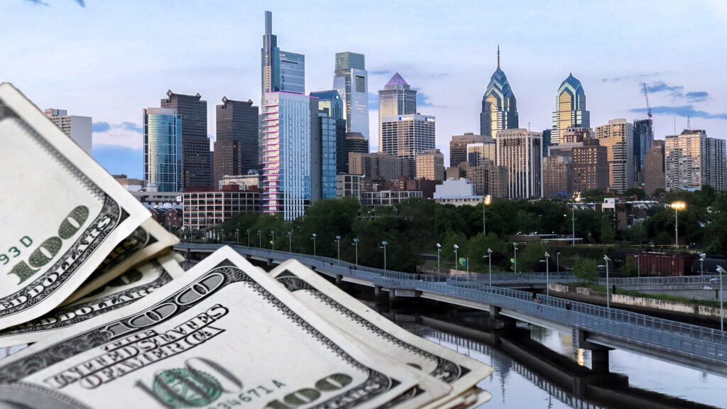 phillyskyline-schuylkillbanksboardwalk-stimmy-money Piles of money are illustrated alongside Philly's skyline