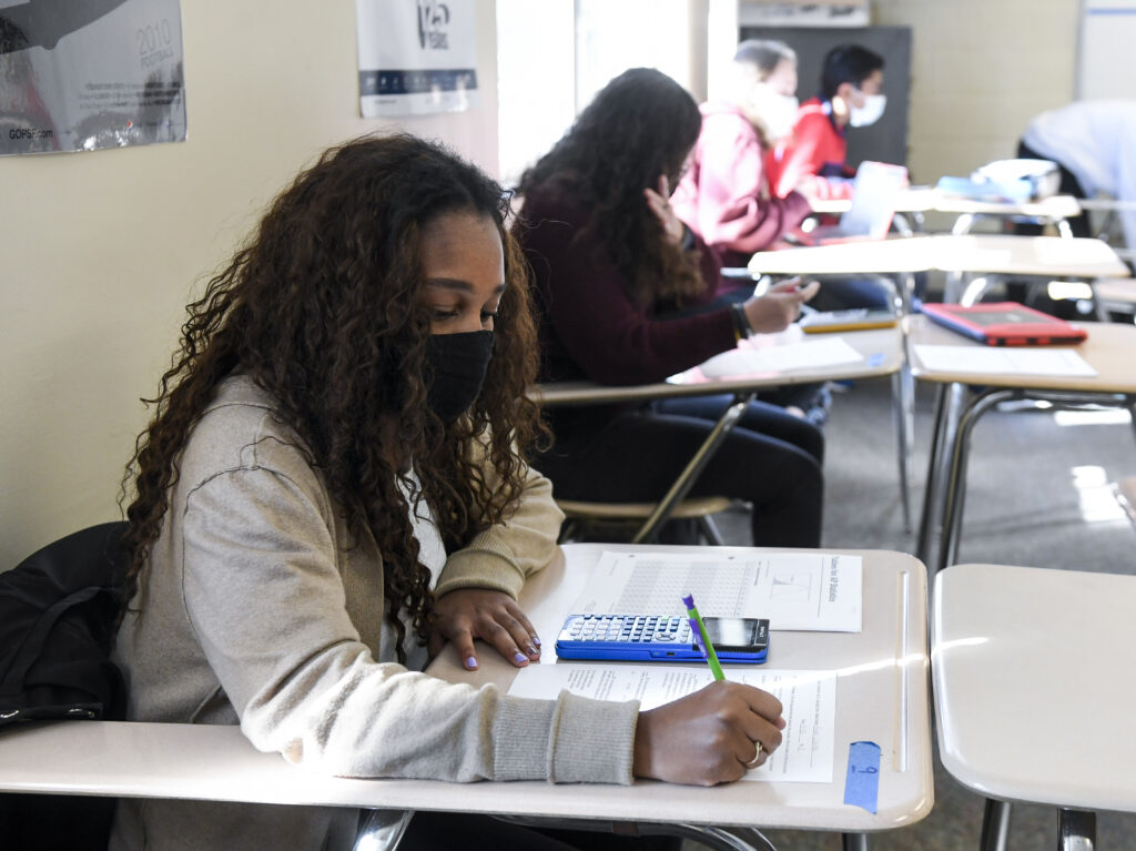 Giani Clarke, 18, a senior at Wilson High School in West Lawn, Pa., takes a test in her AP statistics class earlier this month. The desks are doubled as a way to provide more social distancing. Giani Clarke, 18, a senior at Wilson High School in West Lawn, Pa., takes a test in her AP statistics class earlier this month. The desks are doubled as a way to provide more social distancing. (MediaNews Group/Reading Eagle vi/MediaNews Group via Getty Images)