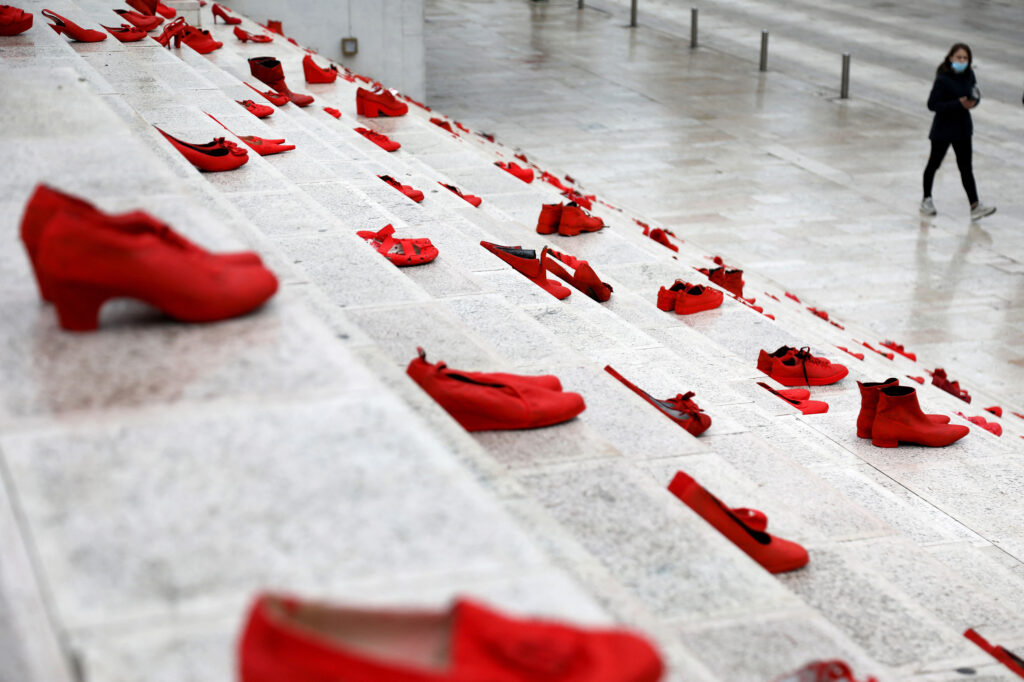 The red shoes are part of a public art installation denouncing violence against women. The photo was taken at Durresi main square in Tirana, Albania, on March 8 — International Women’s Day. The red shoes are part of a public art installation denouncing violence against women. The photo was taken at Durresi main square in Tirana, Albania, on March 8 — International Women's Day. (Gent Shkullaku/AFP via Getty Images)