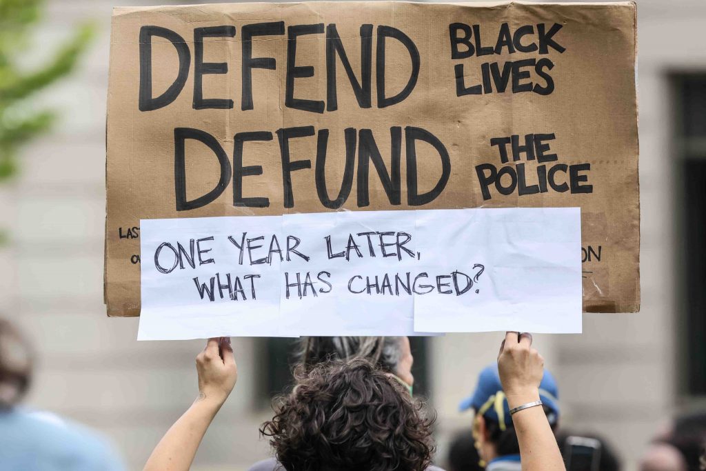 News 2021 – APR 25 – We Still Can’t Breathe March Against Police Brutality A protester holds up a sign during a We Still Can’t Breathe March