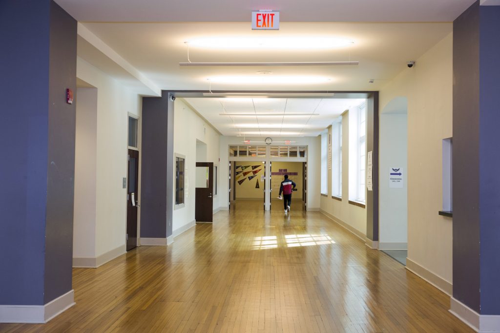 2020 03 12-r wisniewski-DC renovated schools-cardozo high school Washington DC keystone crossroads A student walks through the halls of Cardozo High School