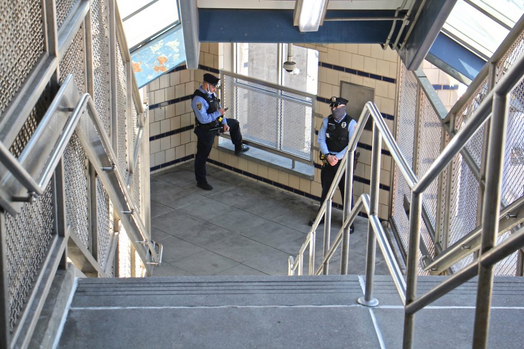 2021 04 05-e lee-philadelphia somerset station septa market frankford-police stairwell SEPTA police officers stand guard in the freshly cleaned stairwell at Somerset Station on the Market-Frankford line. (Emma Lee/WHYY)