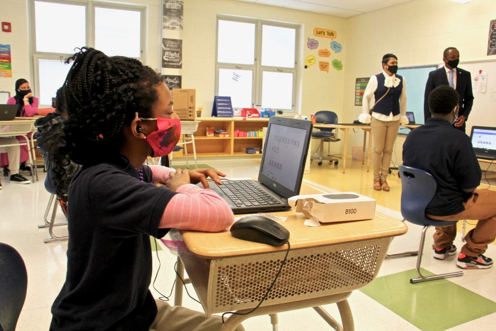 2021 04 19-e lee-camden nj h b wilson elementary school-return to classroom hybrid learning welcome desks Students settle in at their desks