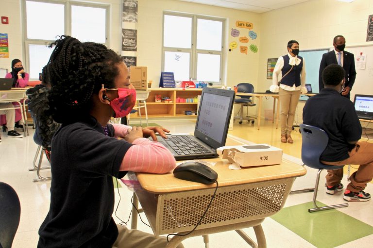 Students settle in at their desks
