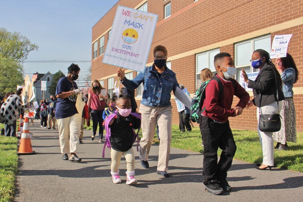 2021 04 19-e lee-camden nj h b wilson elementary school-return to classroom hybrid learning welcome escort Teachers escort students to H.B. Wilson Elementary School